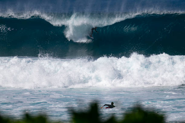 istock Under the lip takeoff at Pipeline Hawaii 1464014433