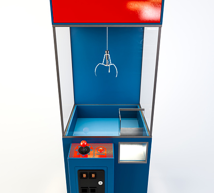 An empty arcade type claw grabber game on an isolated white background - 3D render