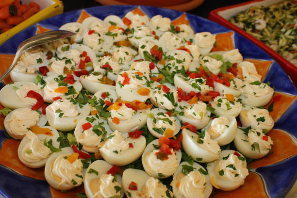 Hard-boiled eggs with red pepper and parsley mayonnaise  Meal buffet