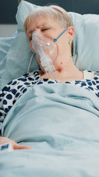 istock Retired woman with oxygen tube against respiratory problem 1464017838