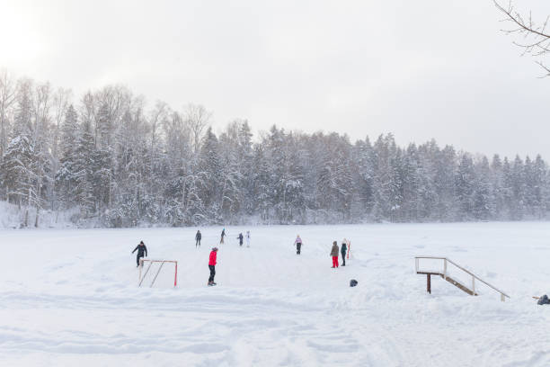 People skating on frozen lake