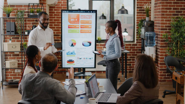 istock Business people receiving applause and presenting financial project 1464020588