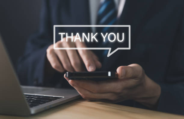 istock business people using smartphones Send a thank you message 1464020629