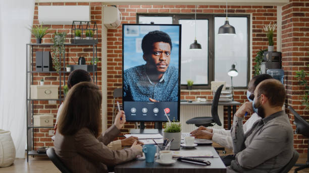 istock Business people using remote video call chat on monitor 1464021033
