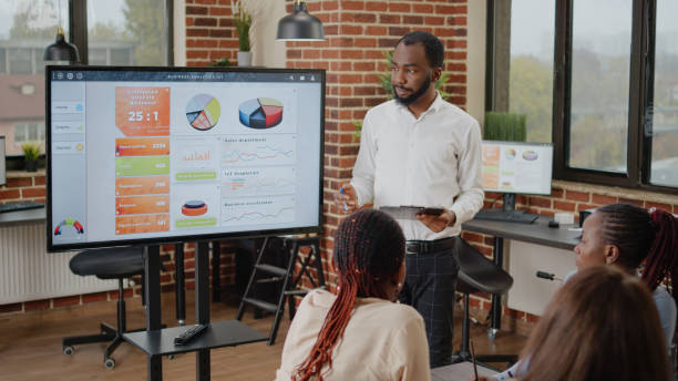 istock African american man doing financial presentation with charts 1464022283