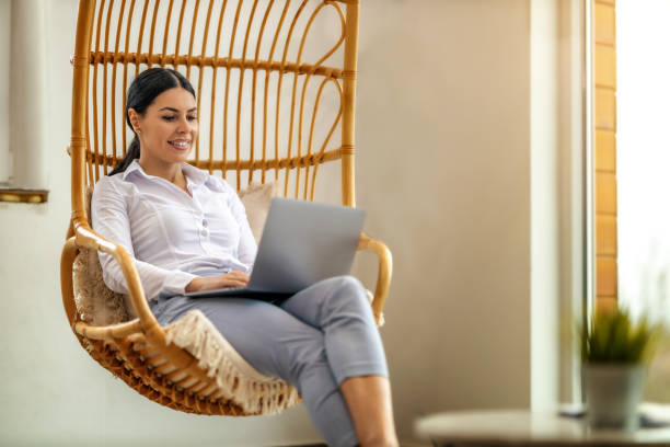 istock Beautiful young businesswoman using laptop in modern office. 1464025828