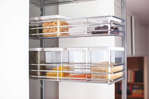 Pantry in the kitchen. Organization system. An organized pantry will help to keep clutter off of your counters.