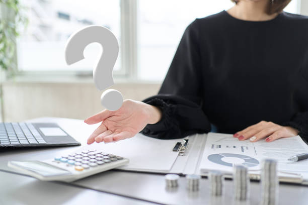 Woman's hand answering investment questions Woman's hand answering investment questions frequently asked questions stock pictures, royalty-free photos & images