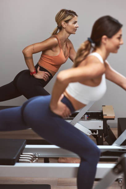 Young women exercising in a gym. stock photo