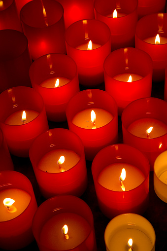 Concept image with group of red votive candle