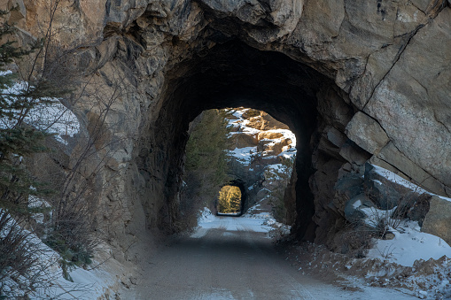 Double tunnels on snow covered dirt road through 11 mile canyon near Lake George, Colorado west of Colorado Springs, USA, North America.