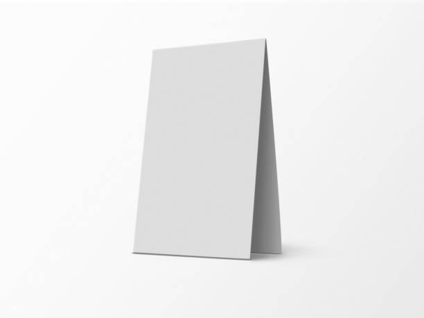 istock A mock-up of blank 3D rendered Tent Card with shadow. White empty desk calendar display mockup for Presentation on isolated background. branding identity for corporate businesses. 1464044556