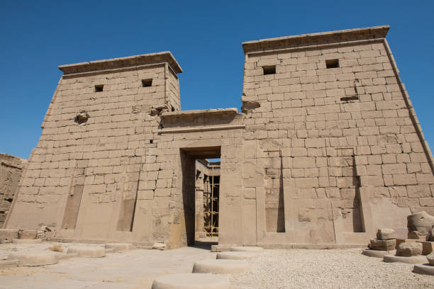 istock Ancient egyptian temple entrance wall with hieroglyphics 1464046309
