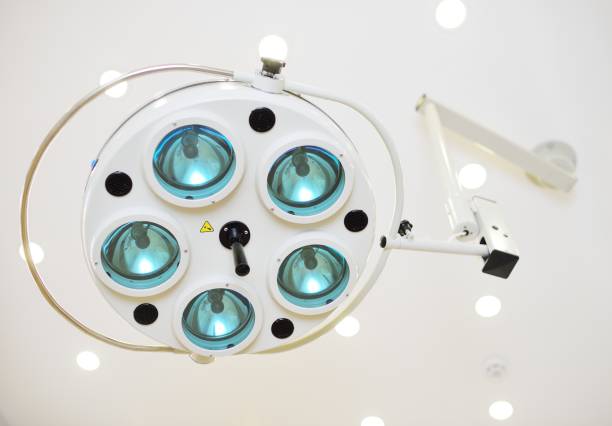 Surgical lamp close-up in a modern operating room on a light background.
