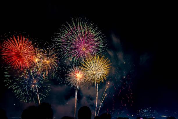 istock Display of bright colorful fireworks against the black sky background 1464058502