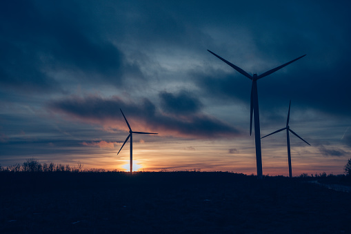 A beautiful view of wind turbines at sunset