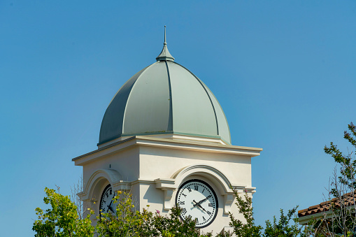 A scenic view of a clocktower against a clear blue sky