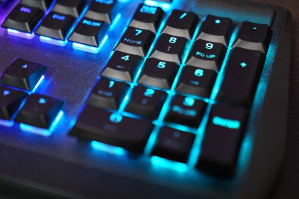 istock Closeup of computer's keyboard with blue light 1464066267