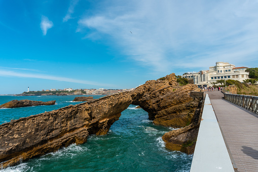 The beautiful Plage du Port Vieux touristic beach with wooden bridge in Biarritz municipality, France