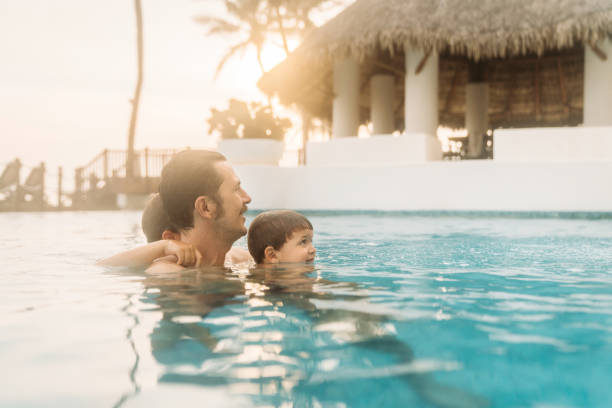 istock Father with son in the pool 1464071042