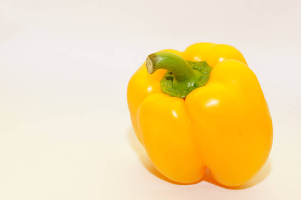 A yellow pepper isolated on a white background