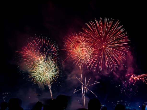 istock Festive night sky with colorful, vibrant fireworks 1464071608