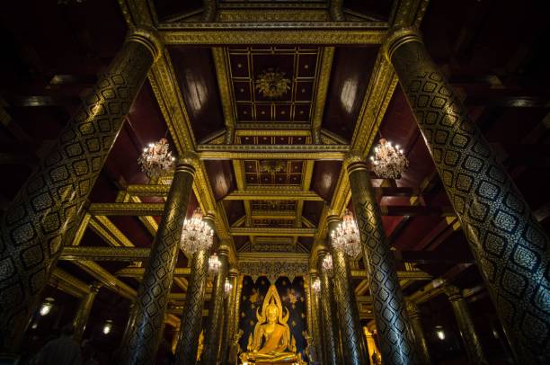 istock Low angle shot inside a golden Buddhist temple with shining pillars and chandeliers in Thailand 1464072628