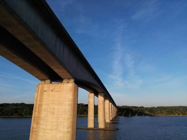 istock Bridge over a calm river on a sunny day 1464072908