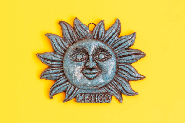 istock Souvenir with sun shape from mexico on a yellow wall 1464073223