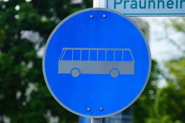 In front of a bus station, the lane is reserved for buses. Sign is a bit weathered, bicycle sign on top. Frankfurt, Germany. Traffic sign no.  245