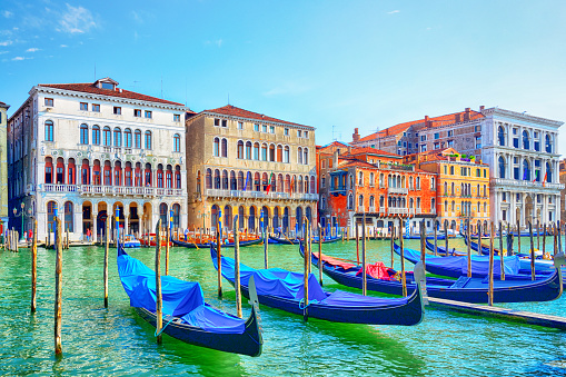 View of San Giorgio Maggiore Island with gondolas from San Marco square in Venice at sunrise, Italy, Europe.