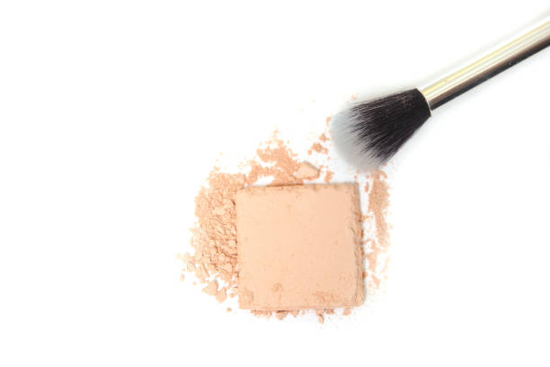istock Closeup shot of a broken eyeshadow with a brush on white background 1464079627