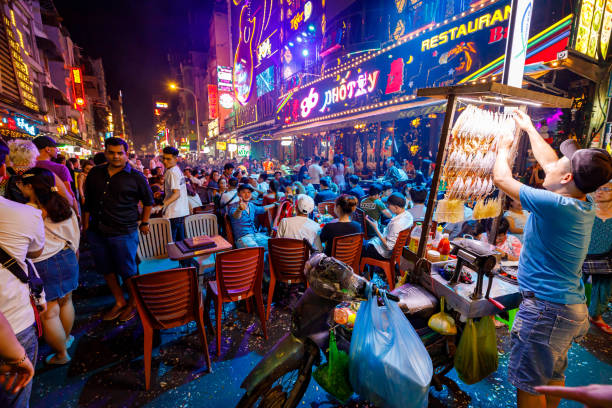 The Backpacker Street of Ho Chi Minh City with crowds of People at New Year evening stock photo