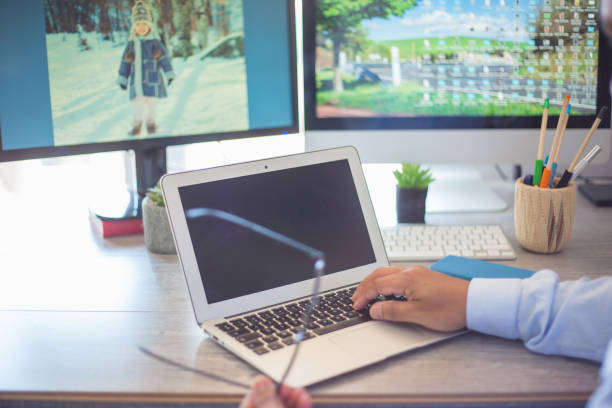 istock Closeup shot of a businessman using his laptop at work 1464081461