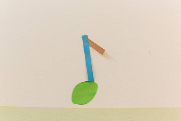 istock A note made of shredded paper sticks to the colored wall. 1464081543