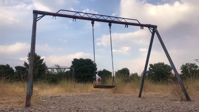 Old rusty swing in an abandoned area