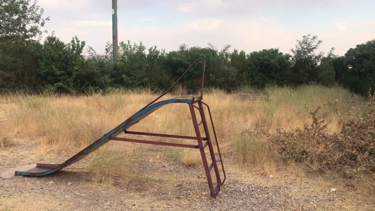 Old rusty play equipment in an abandoned area