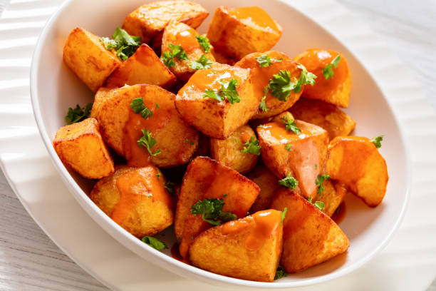 istock patatas bravas, deep fried potatoes with sauce 1464082926