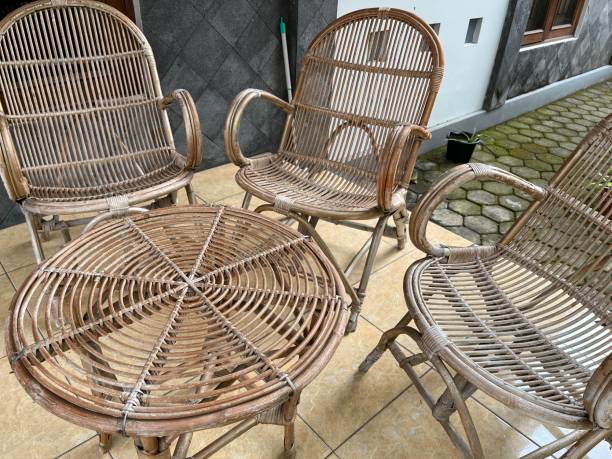 istock Table and chair made from rattan outside a house. 1464087857