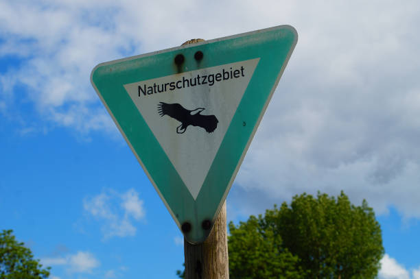 A sign tells you that you are in a nature reserve and that you should follow the rules. Do not leave paths, keep dogs on a leash.