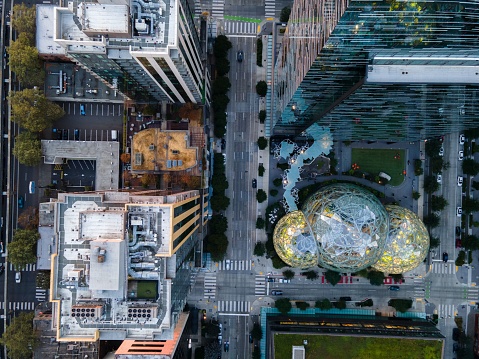 Seattle, United States – August 26, 2022: An aerial shot of an urban landscape with tall, modern, glass buildings in Seattle, Washington