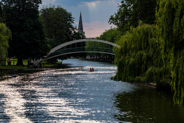 istock Bridge crossing the river surrounded by weeping willow trees. 1464094769