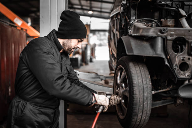 istock mechanic changing the tire 1464095614
