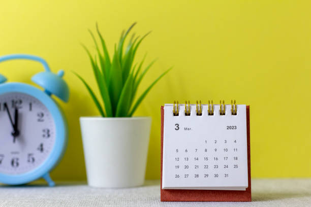 istock A desktop calendar for March 2023 and a clock on the table for planning your time. 1464100651