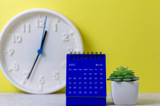 istock A desktop calendar for March 2023 and a clock on the table for planning your time. 1464100667