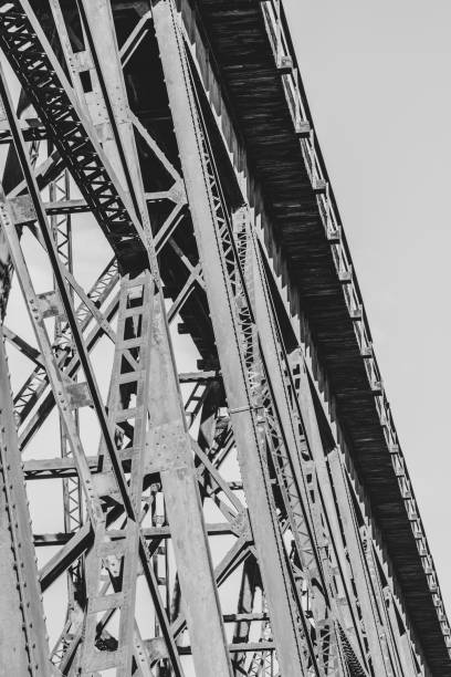 istock Grayscale shot of a Trestle bridge in the daylight 1464101039