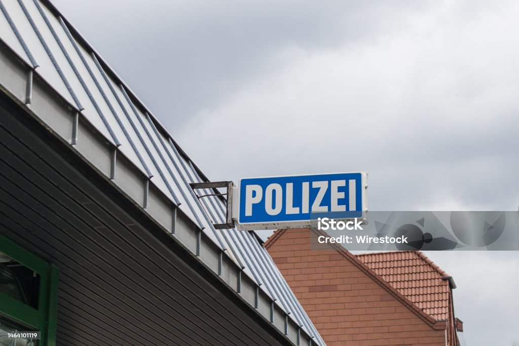 Polizei sign at the facade of a police station in germany. Polizei sign at the facade of a police station in germany. White letters, blue background. Accidents and Disasters Stock Photo