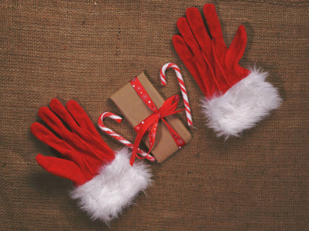 istock Christmas gifts  on burlap background 1464102241