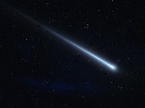 Meteor glowing trail. Shooting star on a black background. Burning meteorite in the starry sky.