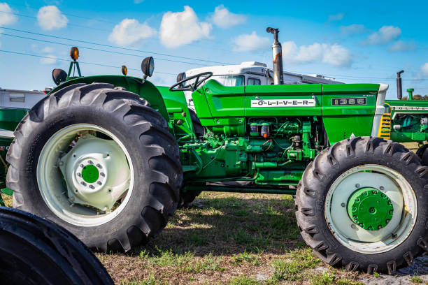 Fort Meade, FL - February 22, 2022: Low perspective side view of a 1973 Oliver 1365 Utility Tractor at a local tractor show.